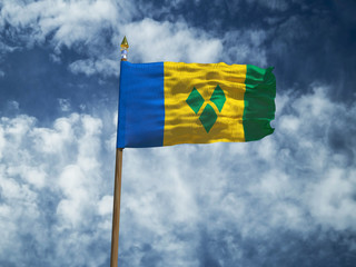 Saint Vincent and the Grenadines flag Silk waving flag of Saint Vincent and the Grenadines made transparent fabric with wooden flagpole gold spear on background sky smoke clouds photo 3d illustration