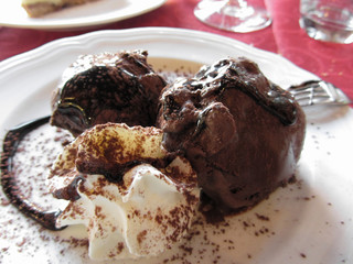 Delicious profiteroles with cream and chocolate glaze
