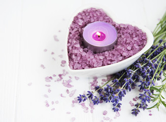 Obraz na płótnie Canvas Heart-shaped bowl with sea salt, soap and fresh lavender flowers