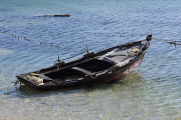 Obraz premium wooden fishing boat moored
