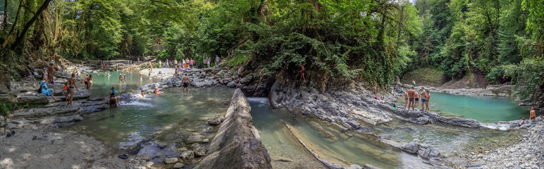 SOCHI, RUSSIA - JULY 25, 2018: People are sunbathing and bathing in the Sochi National Park.