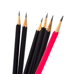 many group of black pencils but pink color standing out from crowd of plenty identical, leadership, independence, uniqueness, initiative, initiative, think different, business success concept