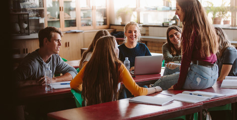 University students chatting during break in class