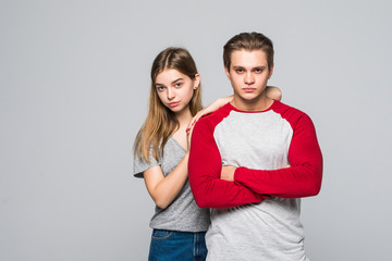 Portrait of two cute teen couples isolated on white background