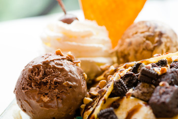 tasty pancakes with chocolate ice cream crispy waffle whipped cream with brownies cherry almond and chocolat syrup on top.served pancakes crepes on plate.sweets dessert brownies pancakes crepes.