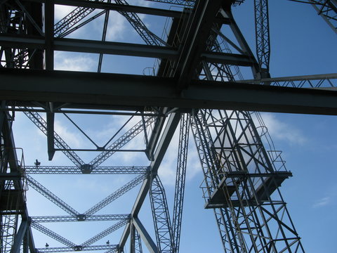 silhouette of details of steel tower, working platform, industrial building site, risky workplace