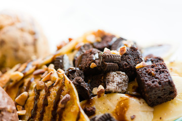 tasty pancakes with chocolate ice cream crispy waffle whipped cream with brownies cherry almond and chocolat syrup on top.served pancakes crepes on plate.sweets dessert brownies pancakes crepes.