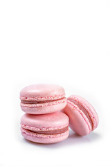 Pink macaroons or macaron isolated on a white background whith place for insert text. Copy space