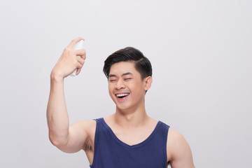 Handsome man with perfume close up portrait studio on white background