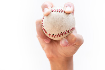 Baseball player : Four Seam Fastball Grip, Mans hand gripping a hardball about the throw a pitch, isolated on white.