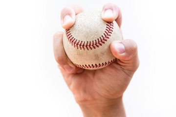 Two seam fastball grip - close up on a white background with copy space.
