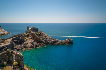 Bay Portovenere, cinque terre, italy view of san pietro church from the fort