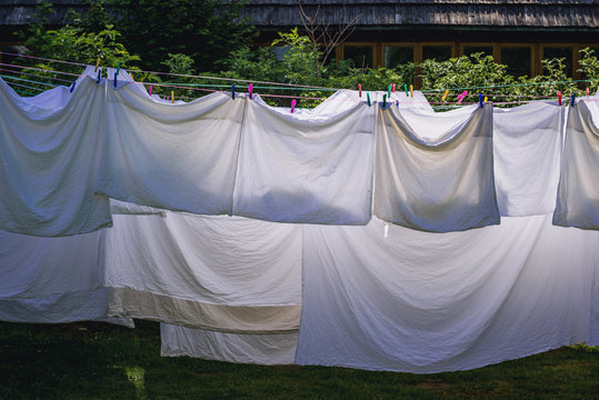 Sheets and pillow cases dries on a ropes