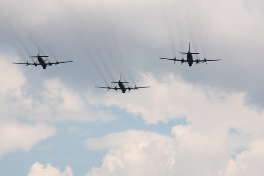 Three Large Military Aircraft With A Jet Stream