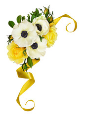 White anemones and yelow rose flowers and buds in a floral arrangement
