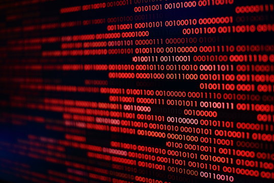 red binary code. computer technology background. red binary code computer language data transfers. unsecured and dangerous big data and ai artificial intelligence cyber network.