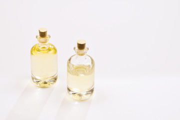 Natural oil in bottles on white background