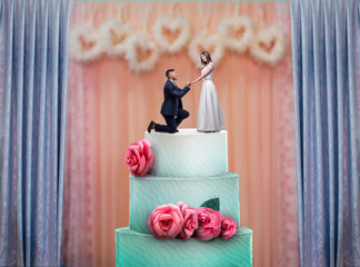 Wedding cake with bride and groom statuettes