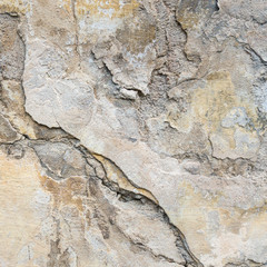 Old Wall With Peel Grey Stucco Texture. Retro Vintage Worn Wall Background. Decayed Cracked Rough Abstract Wall Surface.