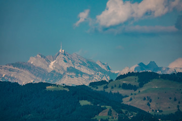 View of the Upper Zrucih Lake (Obersee), with the Santis peak and the village of Busskirch in the background, Sankt Gallen, Switzerland