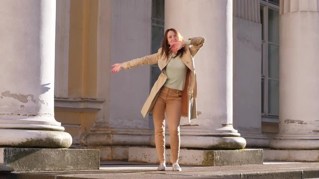 Happy woman dance on street