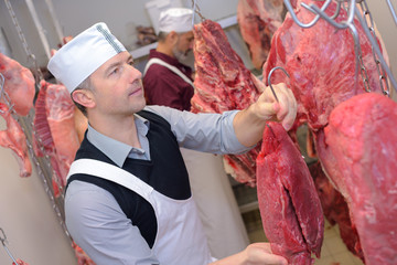 red meat hanging on the hooks