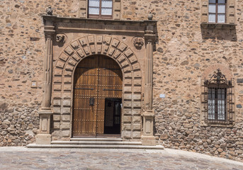 Episcopal Palace located in Plaza Santa Maria, main façade, Renaissance style, has a half-point arch pontoon adorned by a double row of ashlars, Caceres, Spain