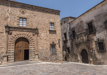 Naklejka premium Episcopal Palace located in Plaza Santa Maria, main façade, Renaissance style, has a half-point arch pontoon adorned by a double row of ashlars, Caceres, Spain