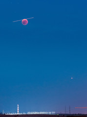 Red Moon with airplane and Mars