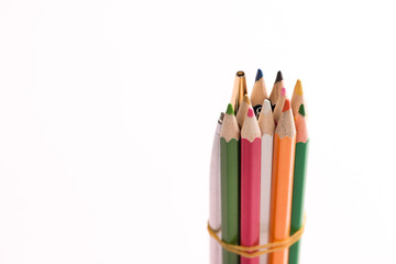 Close up color pencils isolated on white background.