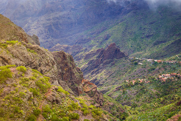 Mountain serpentine. Landscape of the Masca Gorge. Beautiful views of the coast with small villages in Tenerife, Canary Islands