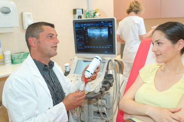 young woman viewing an ultrasound result