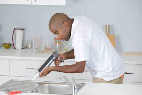 plumber in kitchen