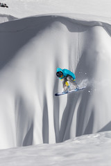 Flying snowboarder on mountains. Extreme winter sport.