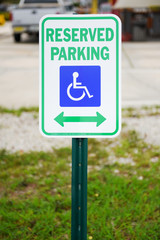 Reserved Parking sign handicapped symbol and arrow pointing left and right