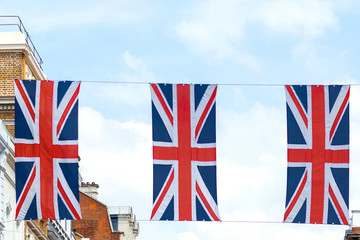 Fototapeta na wymiar Union Jack flags against a blue sky
