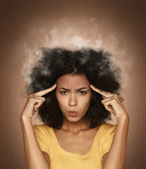 Funny portrait of very pensive girl with steam in her head