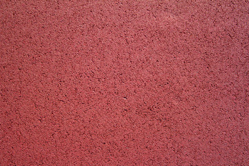 red rubber texture cover ground for child playgrounds.