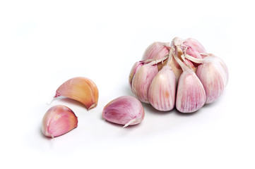 Raw garlic cloves and bulb isolated on white background. High resolution macro close up of garlic. Full depth of field stacked image.