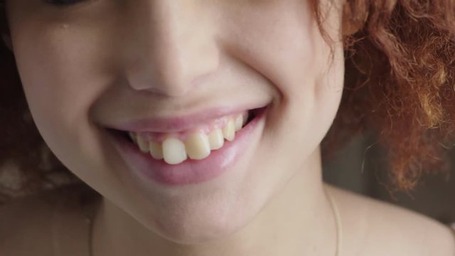 close up woman lips smiling cute happy showing healthy teeth young teenage