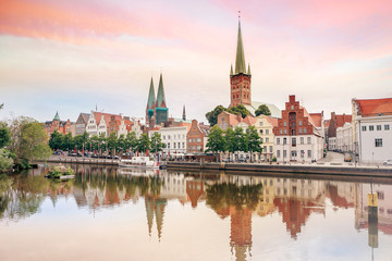 Obraz premium Lubeck old town reflected in Trave river, Germany