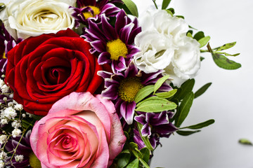  Flowers in a bouquet, festive background of a rose