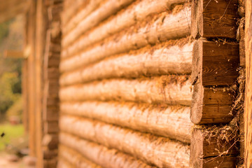 Wooden wall. Traditional house beam. Selective focus