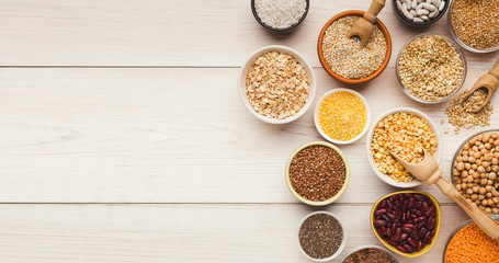 Cereals and legumes assortment on wooden table