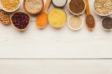 Cereals and legumes assortment on wooden table