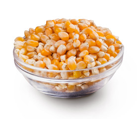 Dry corn in bowl on white background