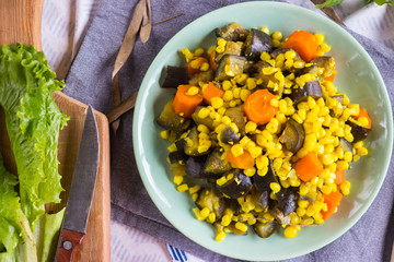 Seasonal vegetable stew with steamed corn, cooked eggplant and carrot. Vegan dinner, vegetarian lunch, healthy food