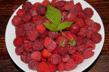 Ripe raspberries in a bowl.