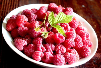 Ripe raspberries in a bowl.