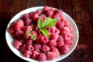 Ripe raspberries in a bowl.